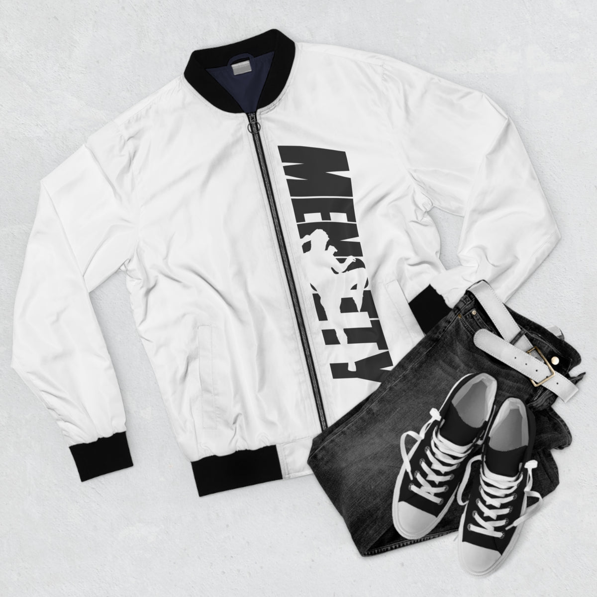 White Mencity bomber jacket in a flat lay with black jeans and black trainers