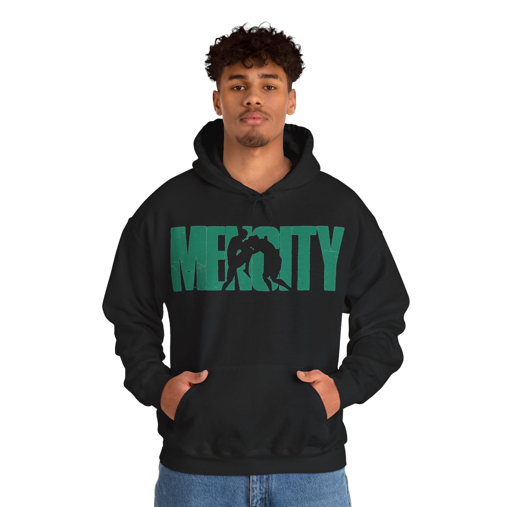 Man wearing the black Mencity Fighter gym hoodie with green MENCITY boxer wordmark, hands in the pocket
