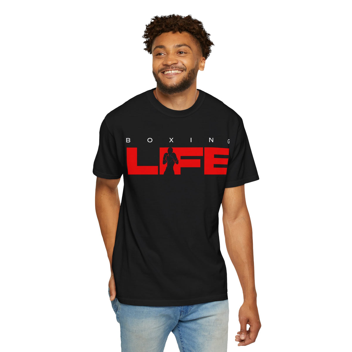 Smiling man wearing the black Mencity Boxing Life gym t-shirt with red LIFE graphic, with jeans